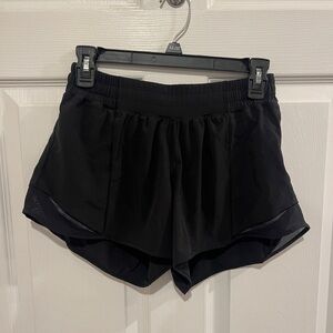 Black Lululemon hotty hots. Size 8 tall. In excellent condition.